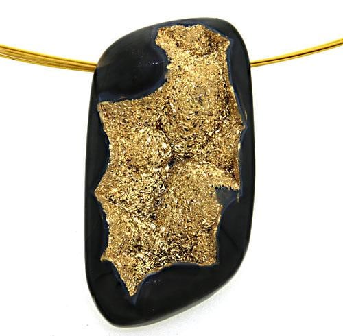 Glistening Gold Plated Druzy Pendant: This Glistening Druzy Pendant features a Surprising Cystal Interior enhanced with a Gold Plating. This Pendant is hung on a 16" Multi-Strand Gold Tone Wire Necklace. This Necklace weighs approx. 16.1