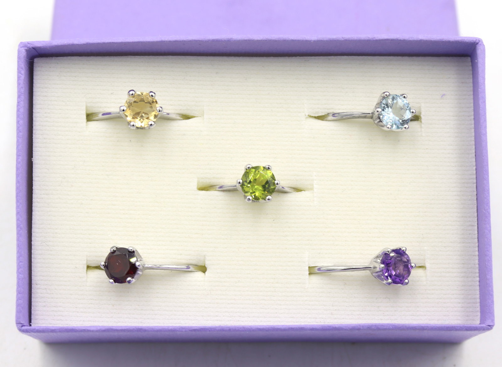 Group lot of 5 sterling silver multi color rings: Group lot of 5, 925 sterling silver multi color rings. Total weight of lot is 7.9 grams. Ring size 6.5".