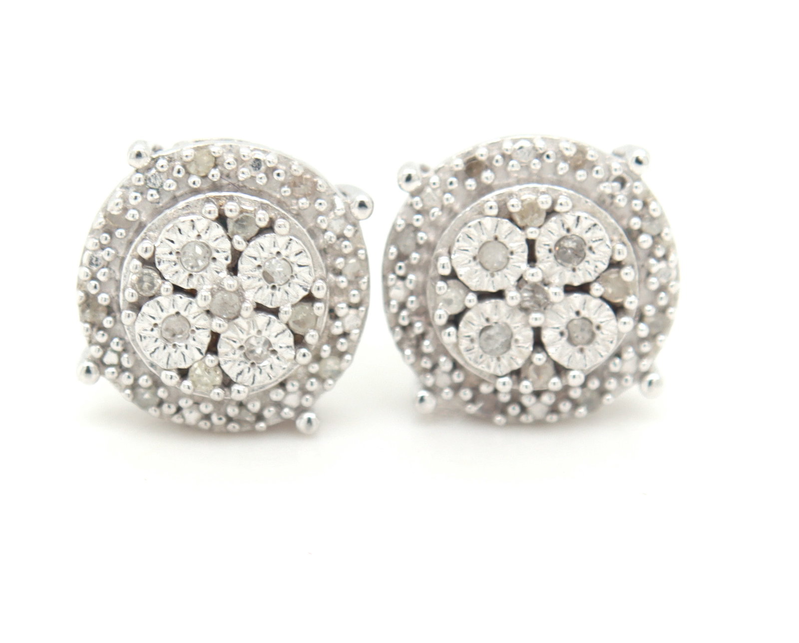 925 Sterling silver 1/10ctw Invisible set diamond stud earrings: 925 Sterling silver 1/10ctw Invisible set diamond stud earrings. The total weight of stud is 2.50 grams.