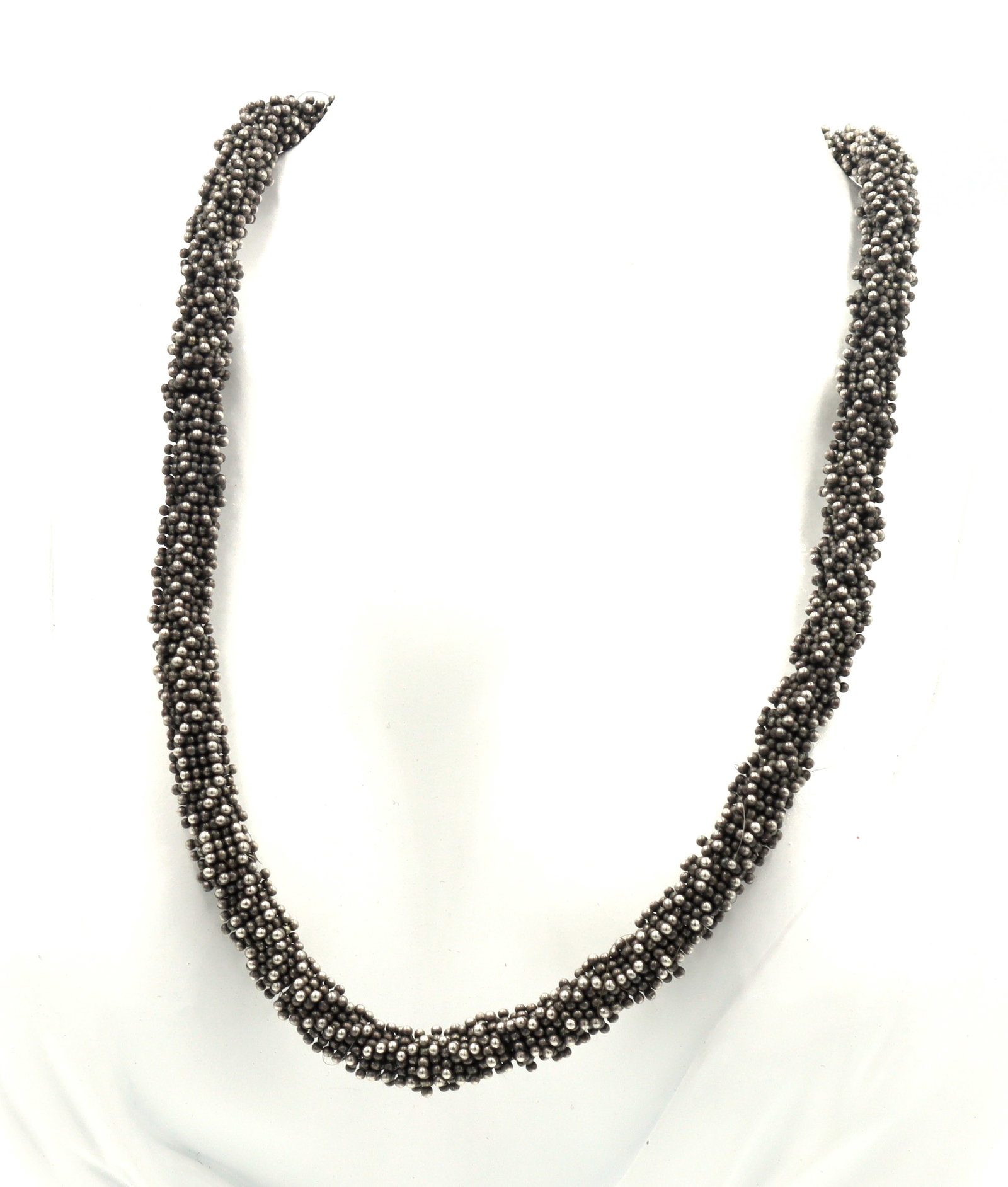 Micheal Dawkins beaded necklace with pearl toggle clasp: Michael Dawkins beaded 15-inch necklace with pearl toggle granulated clasp in 925 sterling silver. The total weight of the necklace is 89.90 grams.