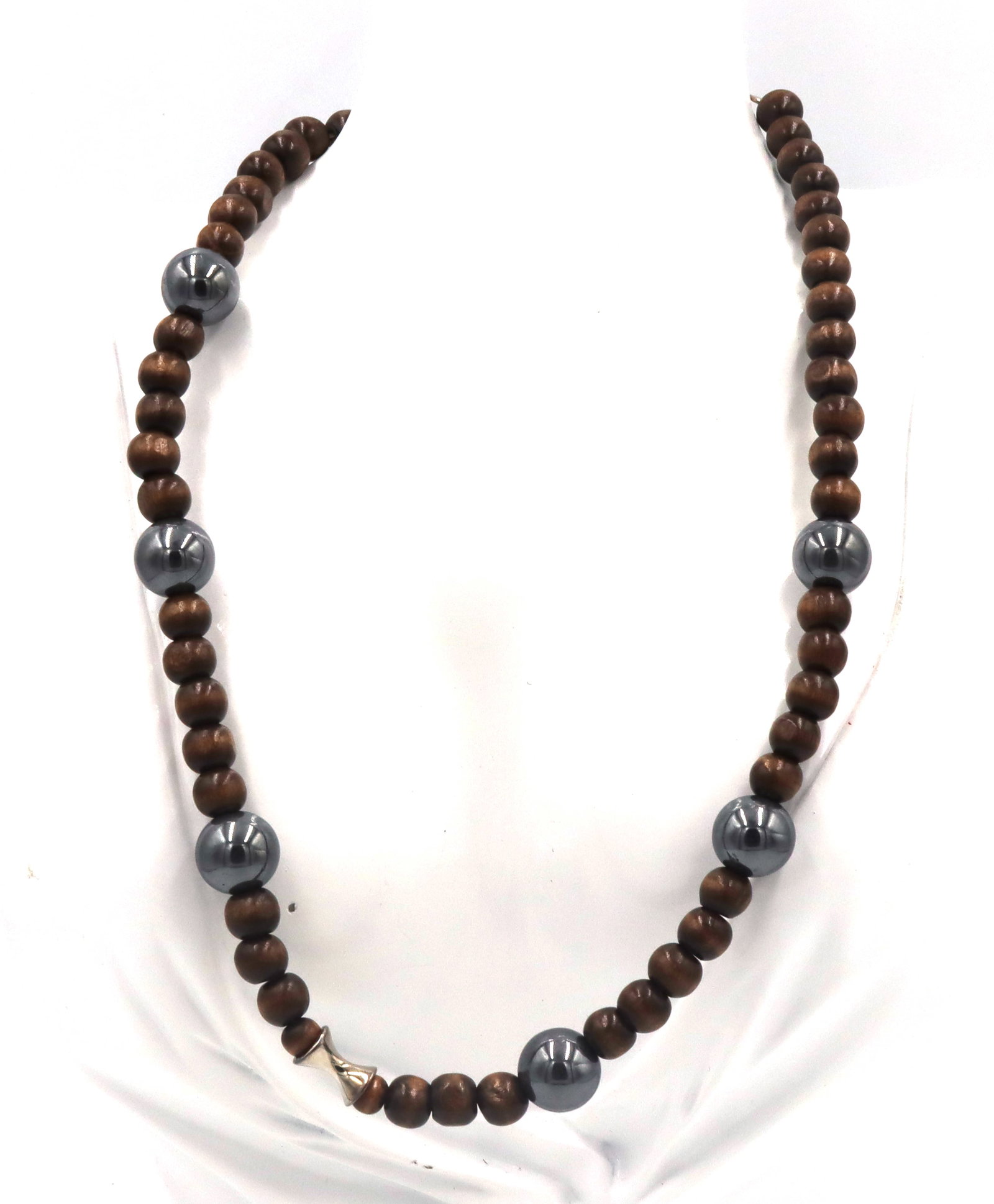 Wooden beads necklace with silver clasp: Wooden beads 18-inch necklace with 925 sterling silver clasp. The total weight of the necklace is 39.6 grams.