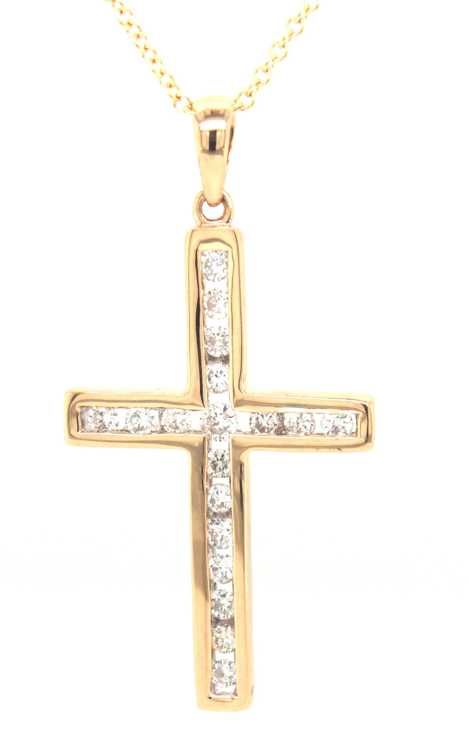 14kt Yellow gold 0.30ctw channel set diamond cross pendant on chain: 14kt Yellow gold 0.30ctw channel set diamond cross pendant on 18-inch chain necklace with spring ring clasp. Color J and SI Clarity. The total weight of the necklace is 3 grams.
