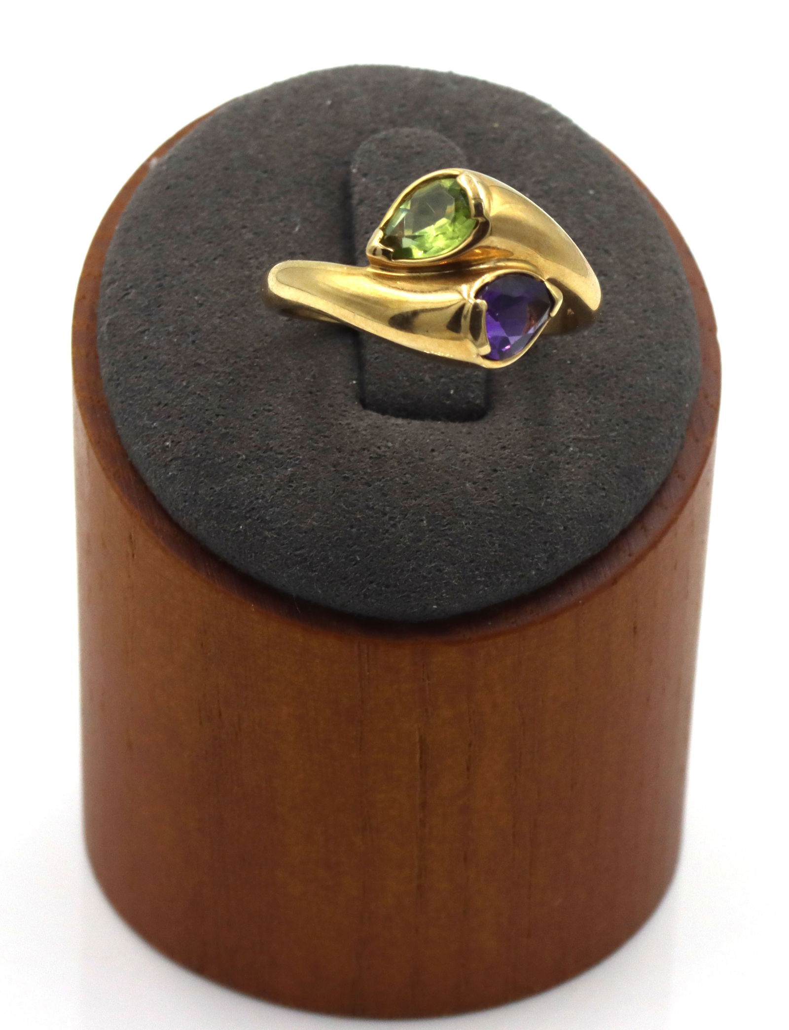 14kt Yellow gold amethyst and peridot bypass ring: 14kt Yellow gold amethyst and peridot bypass ring. The total weight of the ring is 4.3 grams. Ring size 9".