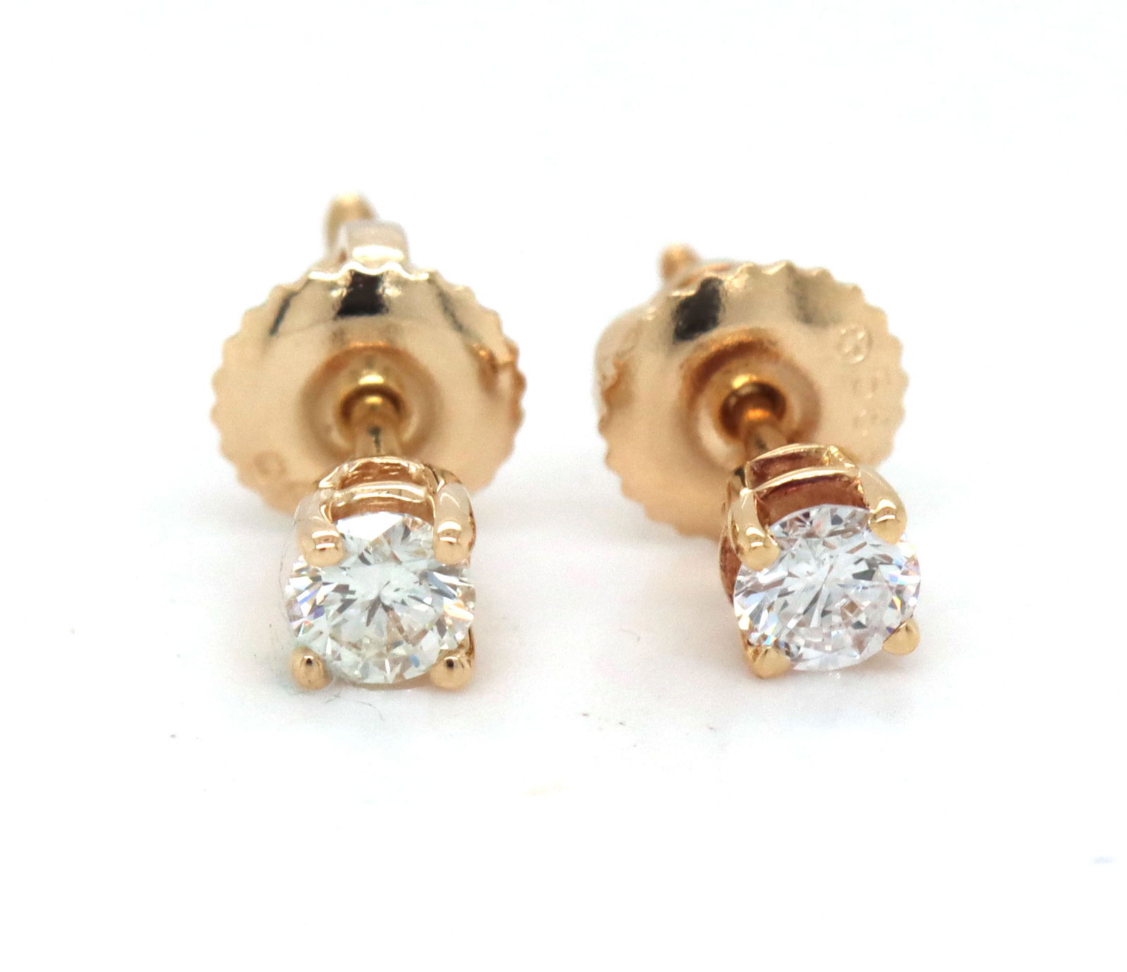 14kt Yellow gold 0.25 diamond stud earrings: One pair of 14kt yellow gold approximate 0.25ctw round brilliant cut diamond stud earrings. The total weight of the earrings is 0.60 grams.