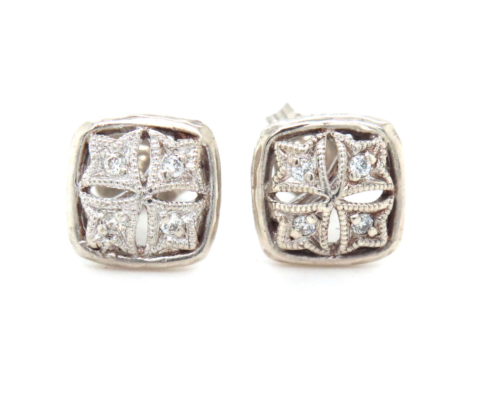Gabriel & Co open work diamond stud earrings in 925 sterling silver: Gabriel & Co open work diamond stud earrings in 925 sterling silver. The total weight of the earrings is 1.20 grams.