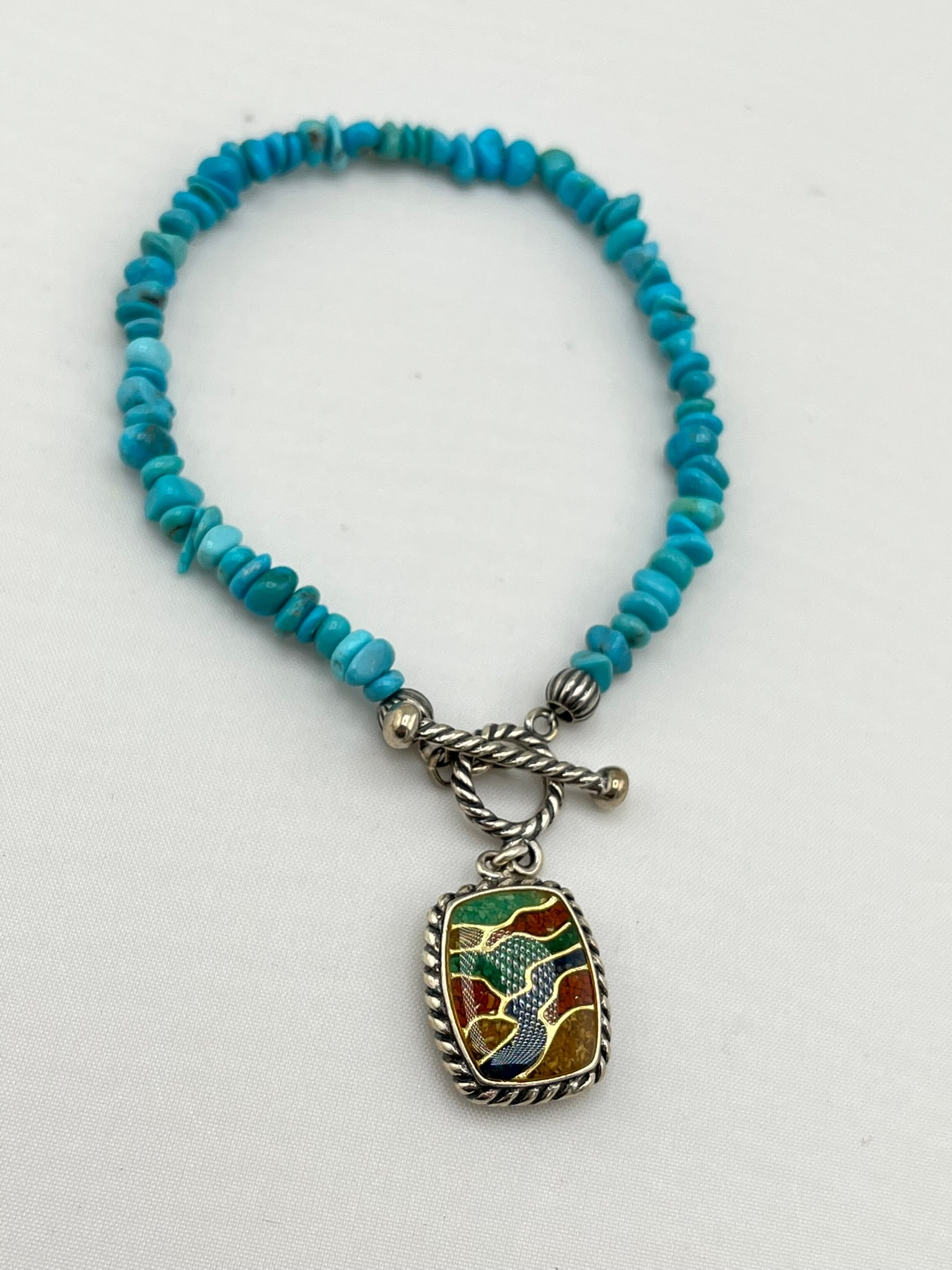 925 Sterling Silver Carolyn Pollack Turquoise beads with Double Side Charm: 925 sterling silver Carolyn Pollack turquoise bead bracelet with double-sided charm. 12.6 grams
