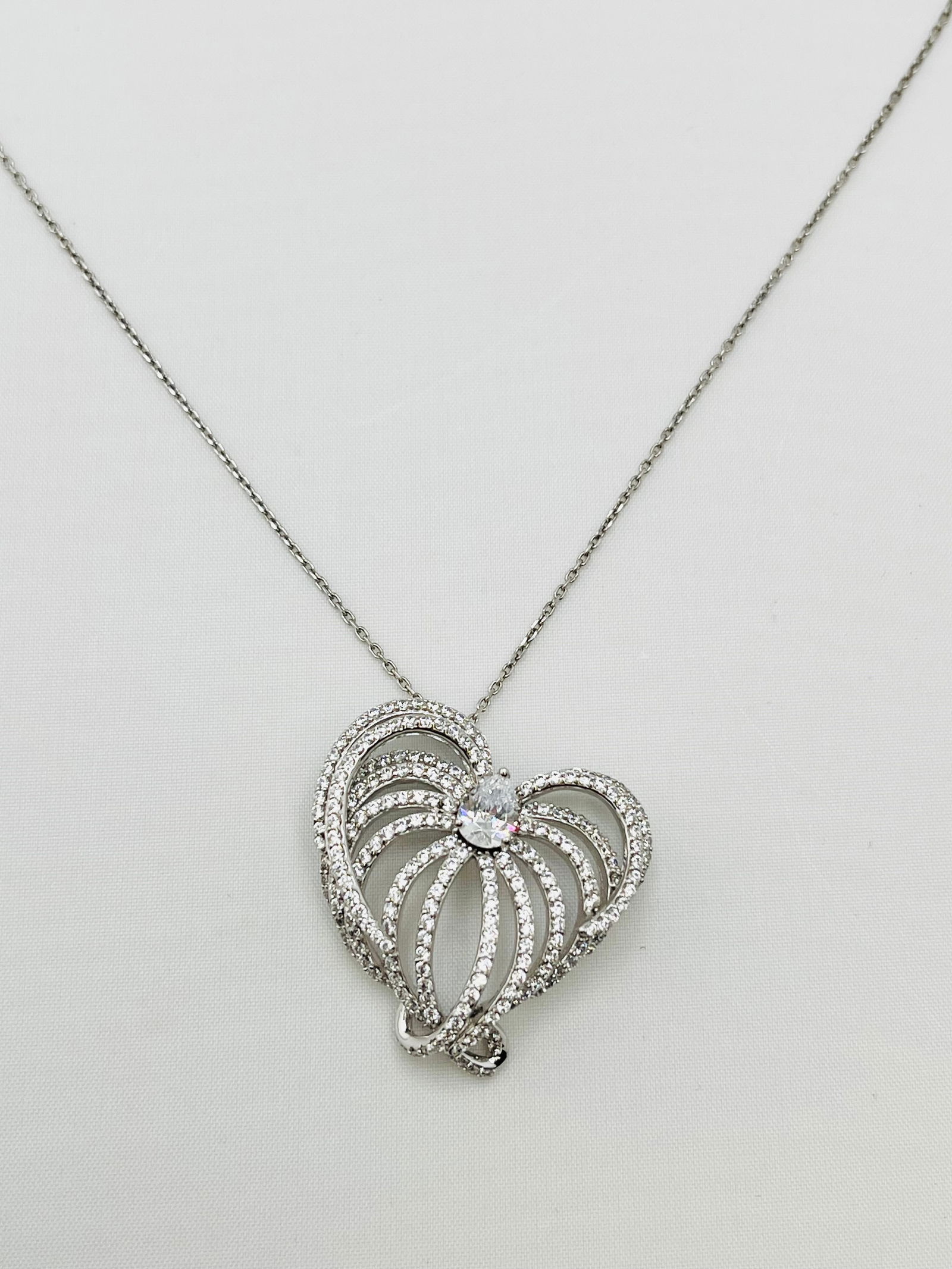 925 Sterling Silver Heart Swirl Style Interwoven Crystal Pave pendant With Chian Necklace: 925 sterling silver crystal pave heart swirl style interwoven design Pendant with chain. 16 inches, 8 grams