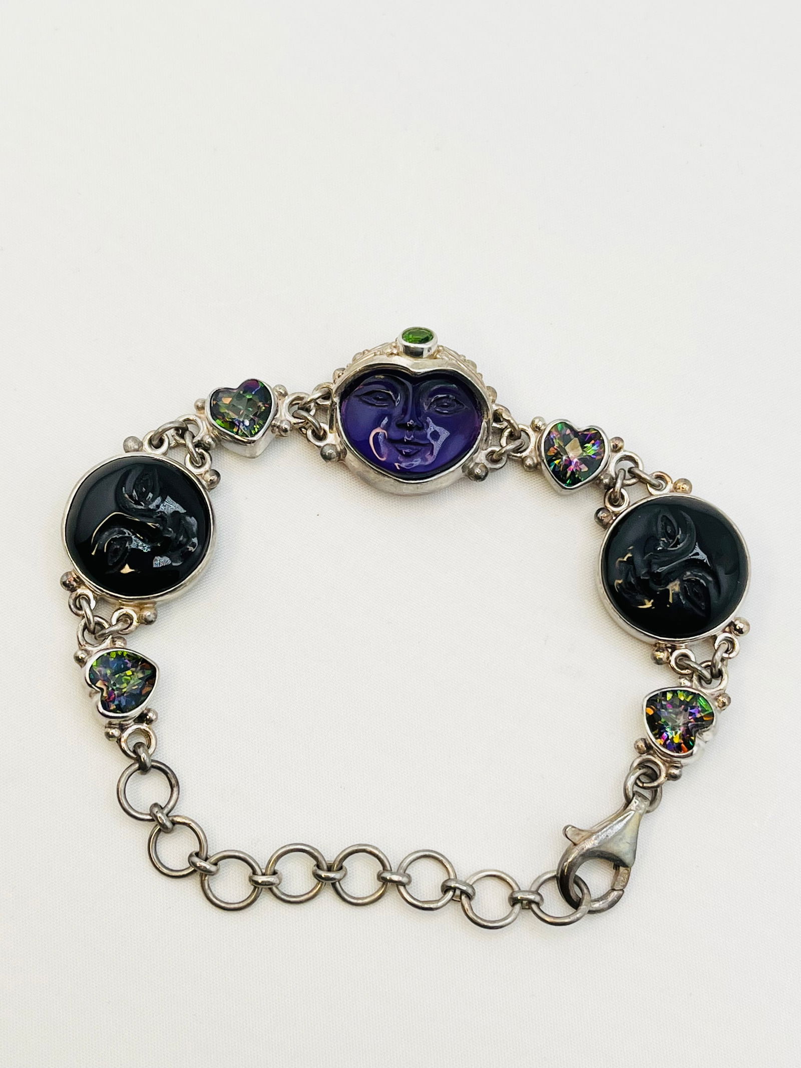 925 Sterling Silver Signed Sajen Hand Made Carved Amethyst And Mystic Topaz Accent Bracelet: 925 Sterling Silver Signed Sajen Handmade Carved Moon Face Amethyst and mystic Topaz accent bracelet . 3508 grams. 9 inch