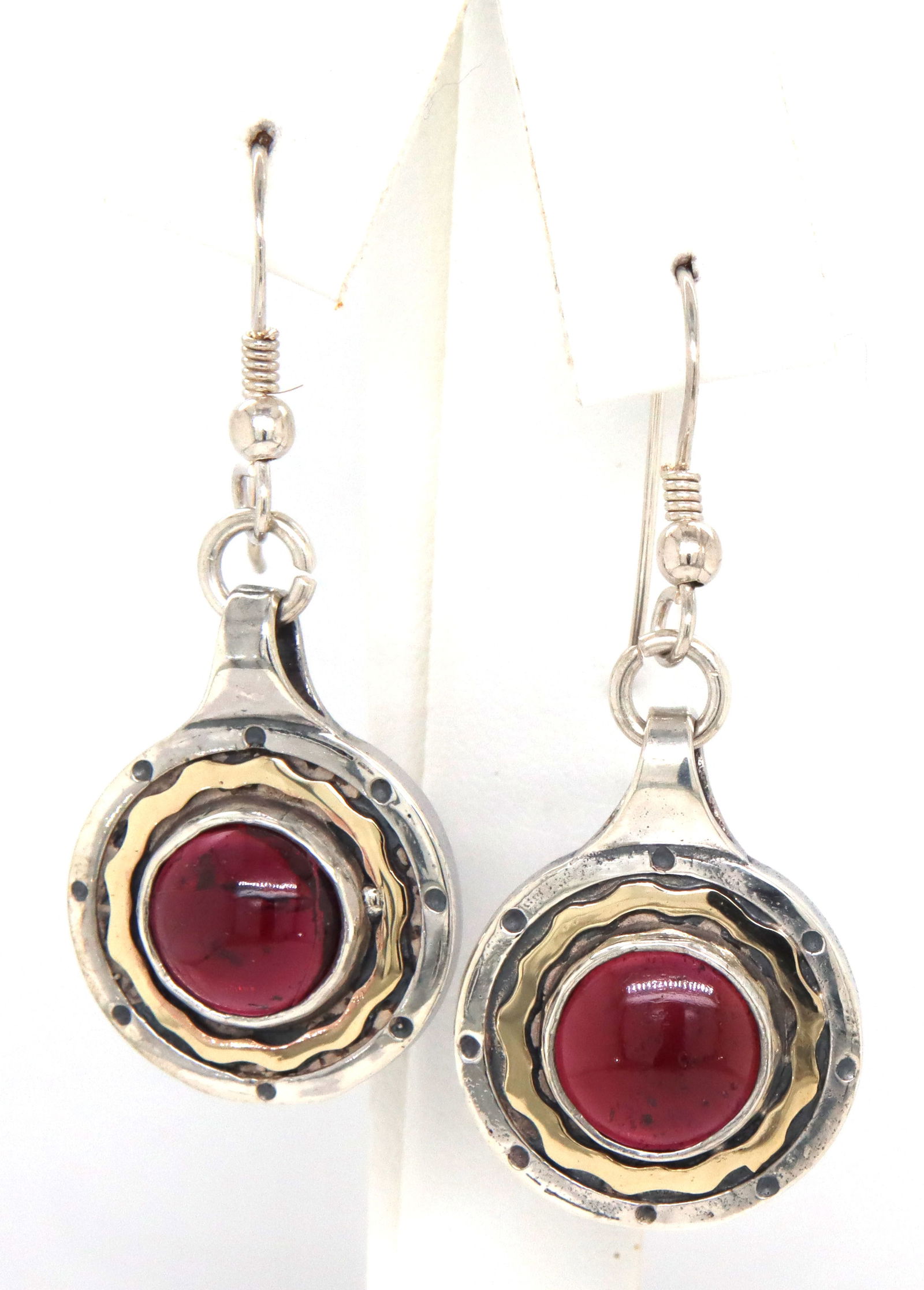 925 Sterling silver Garnet Cab 2 tone earrings: 925 Sterling silver Garnet Cab 2 tone earrings. The total weight of the earrings is 8.16 grams.