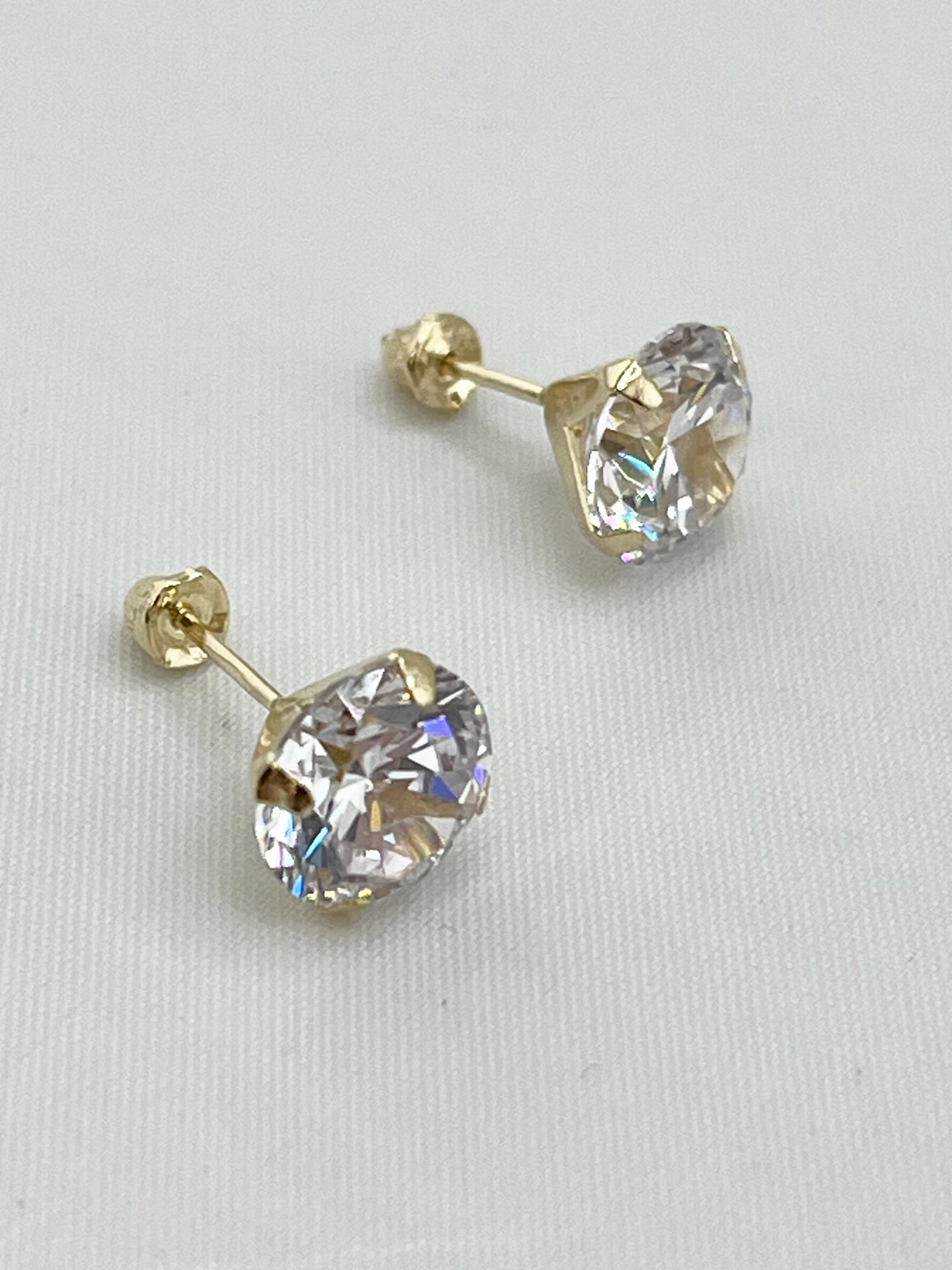 14KT White Gold Two Carat CZ Stud Earrings: 14KT Yellow Gold Setting Two Carat Each Stud Earrings With Screw back. 2 grams