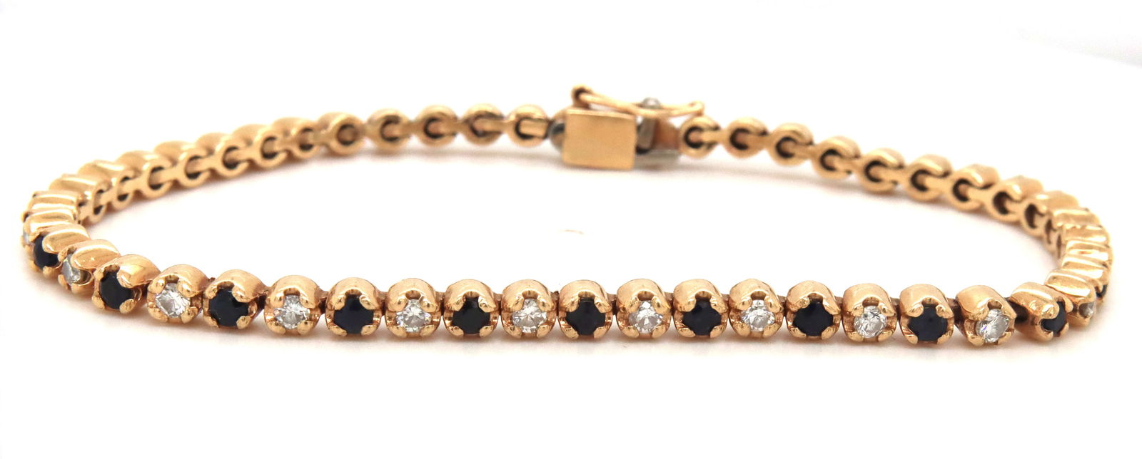 14kt Yellow gold round brilliant cut blue sapphire and diamond link bracelet: 14kt Yellow gold round brilliant cut blue sapphire and diamond link 7-inch bracelet. The total weight of the bracelet is 11.5 grams.
