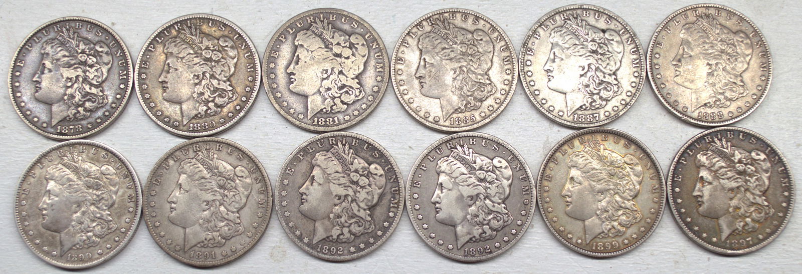 Lot of 12 Morgan Silver Dollars | Mixed Dates & Mints | 1878–1899 | Original U.S. Silver Coins (1 of 2)