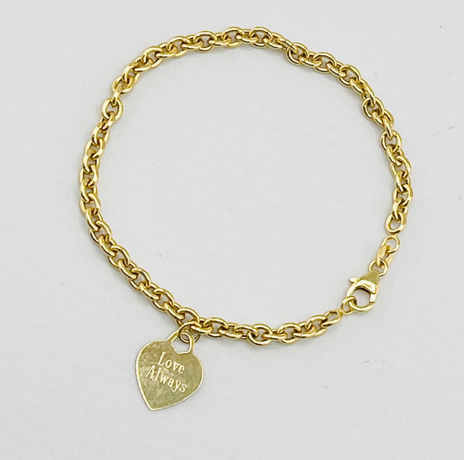 14KT Yellow Gold Rolo Link Engraved Love Always 50Th Heart Charm Bracelet: 14KT Yellow Rolo Link Engraved Love Always 50Th Heart Shape Charm Beadlet. 5.2 grams. 8 inches