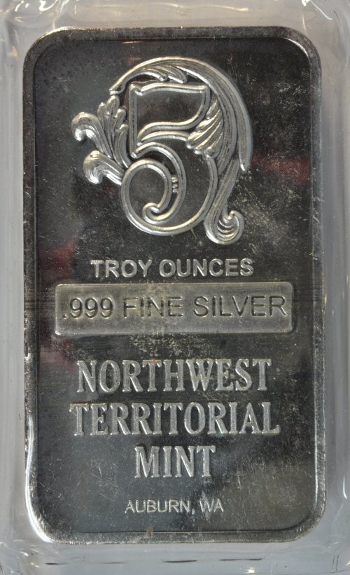 Northeast Territory pure .999 fine silver 5 Troy Oz bar in plastic: Northeast Territory pure .999 fine silver 5 Troy Oz bar sealed in plastic.