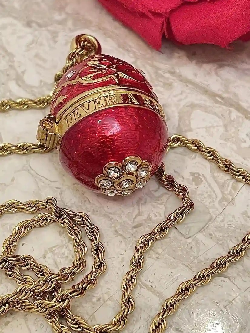 Ruby Red Imperial Egg-Inspired Pendant & Bracelet Set – Handcrafted with 114 Austrian Crystals: A striking tribute to classic European artistry, this handcrafted egg-inspired jewelry set captures the romance and grandeur of old-world design. Rich ruby-red enamel tones are paired with intricate g