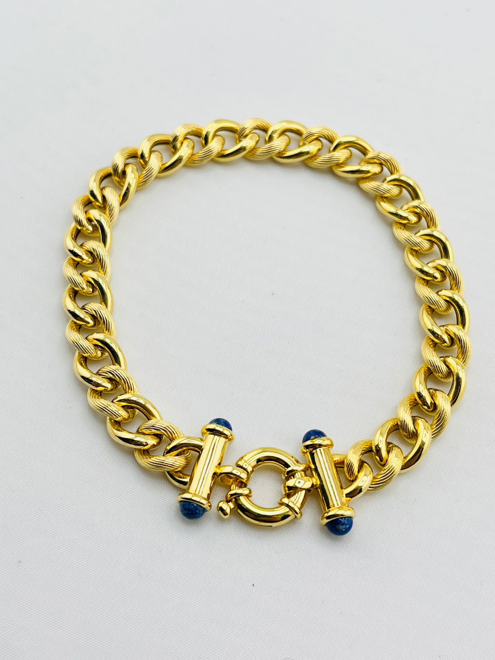Italian 14KT Yellow Gold Curb Link Bracelet: Italian 14KT Yellow Gold Beautiful Brand New Alternative Smooth And Textured Curb Link With Lapis Large Spring Ring Clasp Bracelet. 9.8 grams. Size 8 inches