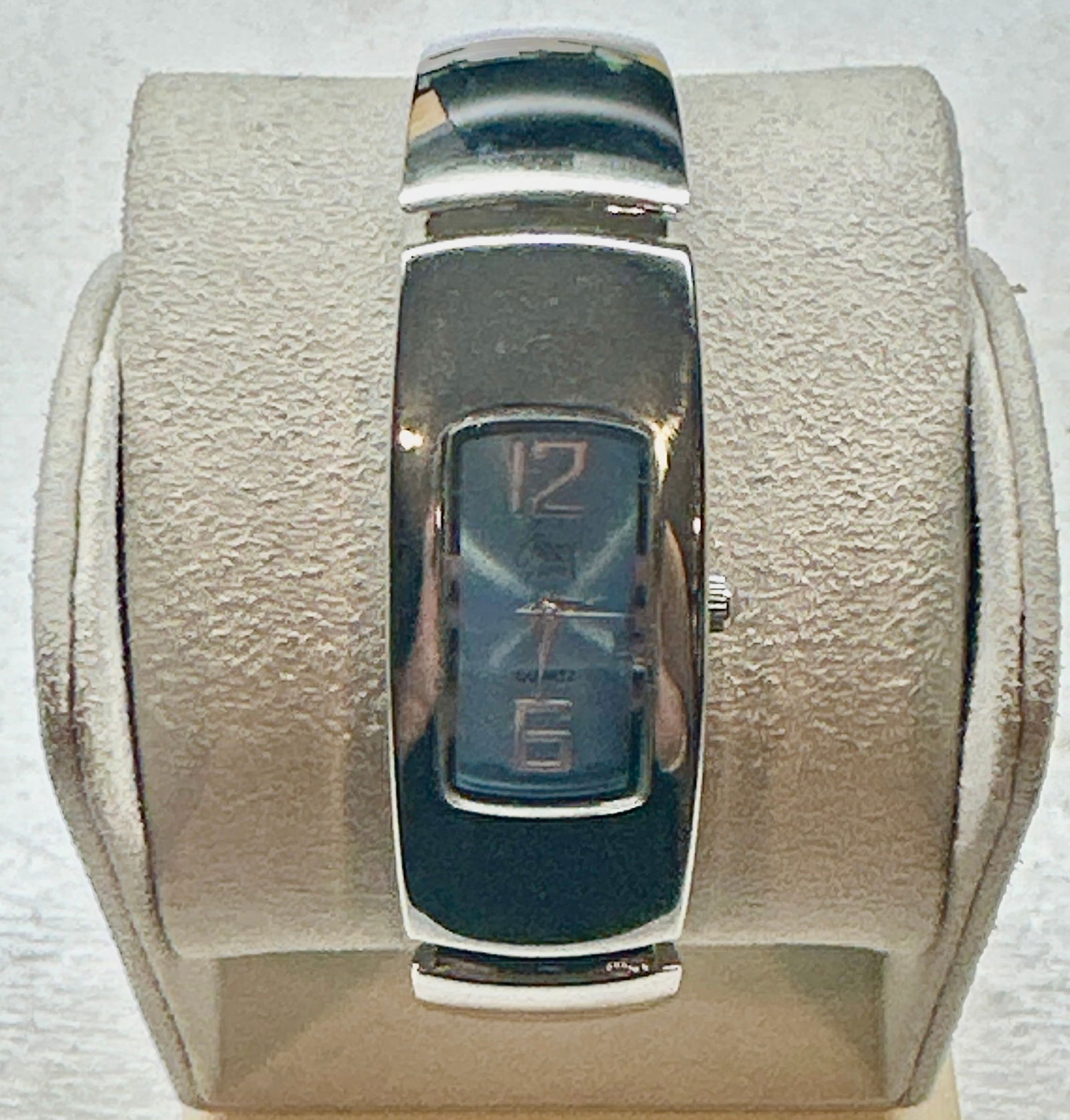 Modern Stainless Steel Blue Dial Cuff Watch Sleek Contemporary Design: Minimal. Polished. Effortlessly modern. This elegant stainless steel cuff watch features a high-polish silver-tone finish paired with a bold black dial insert for a striking contrast. The rectangular