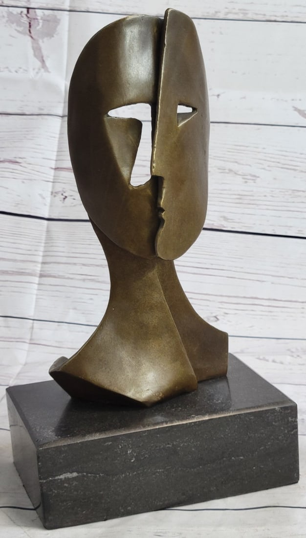Two faces Mask Bronze Sculpture: Woman and Man. The sun on the right represents the woman, the slither of a moon on the left the man. The lines flowing upwards from the nose, eyebrow, and cheek form a repetitive pattern that simultan