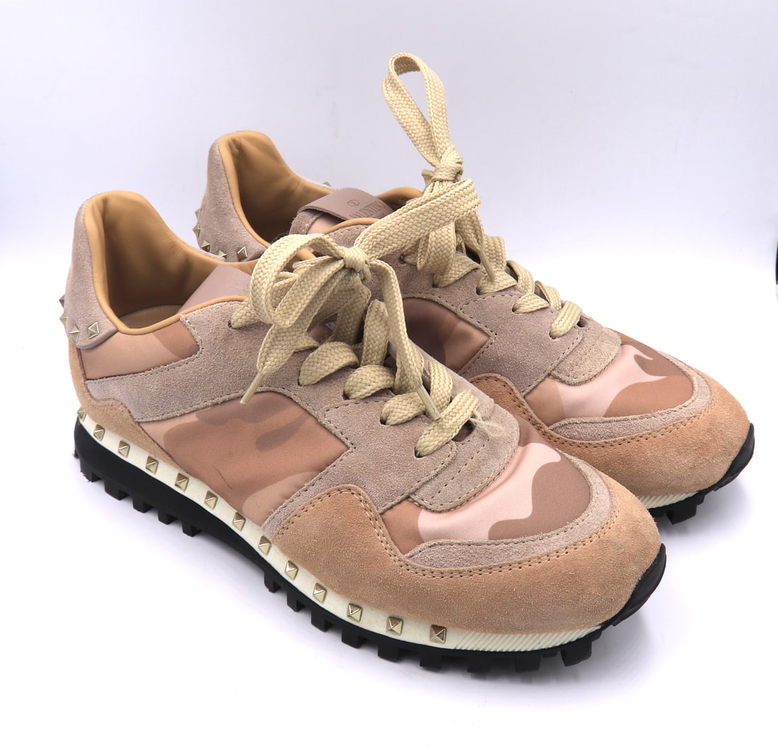 Valentino Garavani Camouflaged Sneaker: Valentino Garavani Rockrunner Camouflaged Sneaker in Pink Color. Comes with Valentino Box and Dust Bag. Size 6 (US)
