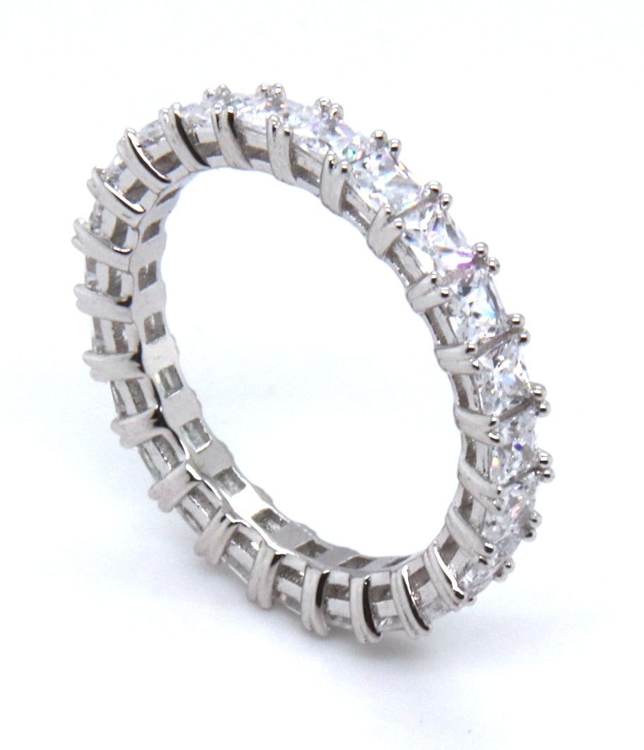 White Cubic Zirconia Sterling Silver Band: White Cubic Zirconia 925 Sterling Silver Band. Total weight of Band 4.55 Grams. Ring Size 8.25"