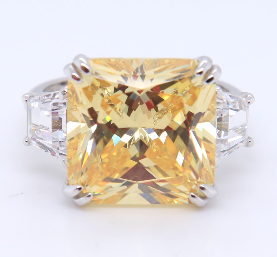 Sterling Silver Emerald Cut Yellow Cubic Zirconia Ring: 925 Sterling Silver Emerald Cut Yellow Cubic Zirconia Ring. Total weight of Ring 9.11 Grams. Ring Size 7.5"