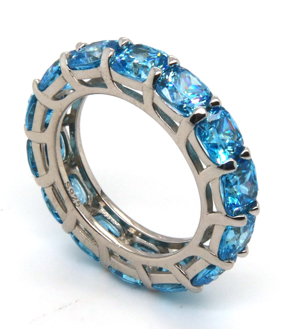 Sterling Silver Blue Cubic Zirconia Band: 925 Sterling Silver Blue Cubic Zirconia Band. Total weight of Band 5.94 Grams. Ring Size 6.5"