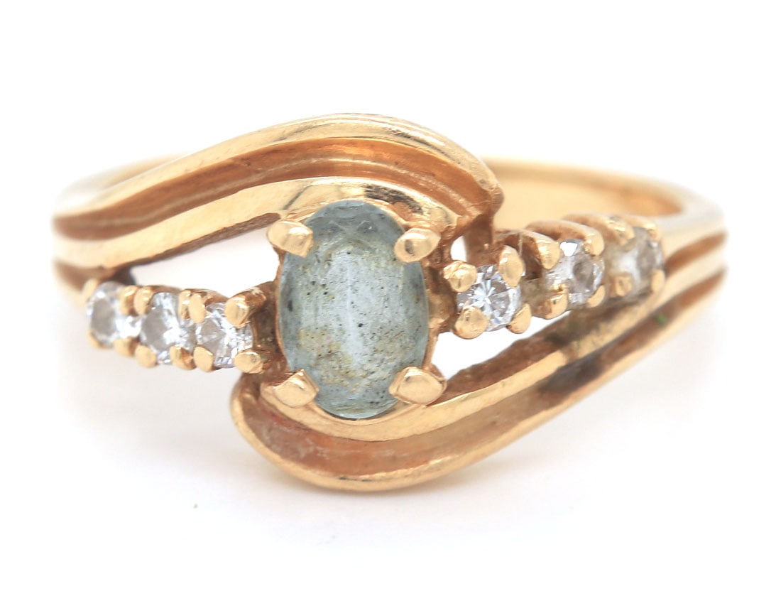 14kt Yellow gold gemstone and diamond ring: 14kt Yellow gold gemstone and diamond ring. Total weight of ring 4.1 grams. Ring size 6.5"