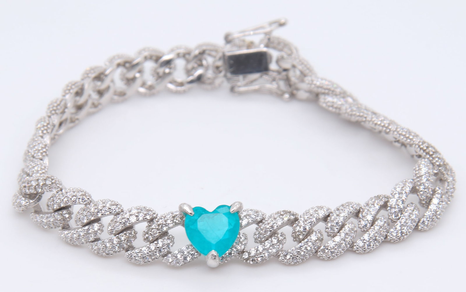 925 Sterling Silver Heart Shaped Cubic Zirconia Curb Link Bracelet: 925 Sterling Silver Heart Shaped Cubic Zirconia 6.5 inches Curb Link Bracelet. Total weight of Bracelet 16.87 Grams.