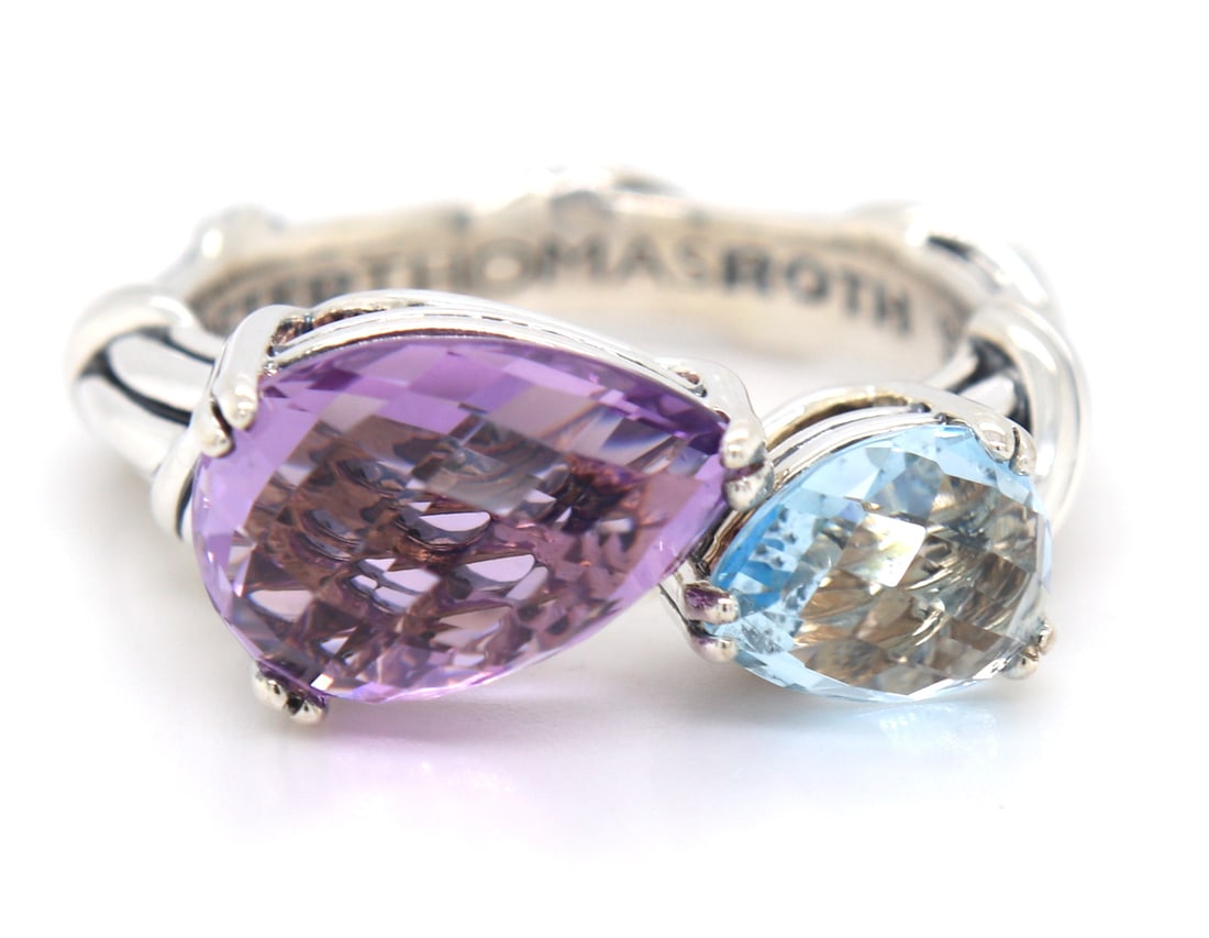 925 Sterling silver Peter Thomas Roth Fantasies pear Bypass amethyst and Blue topaz Ring: 925 Sterling silver Peter Thomas Roth Fantasies pear Bypass amethyst and Blue topaz Ring. Total weight of ring 7.30 grams. Ring size 8"