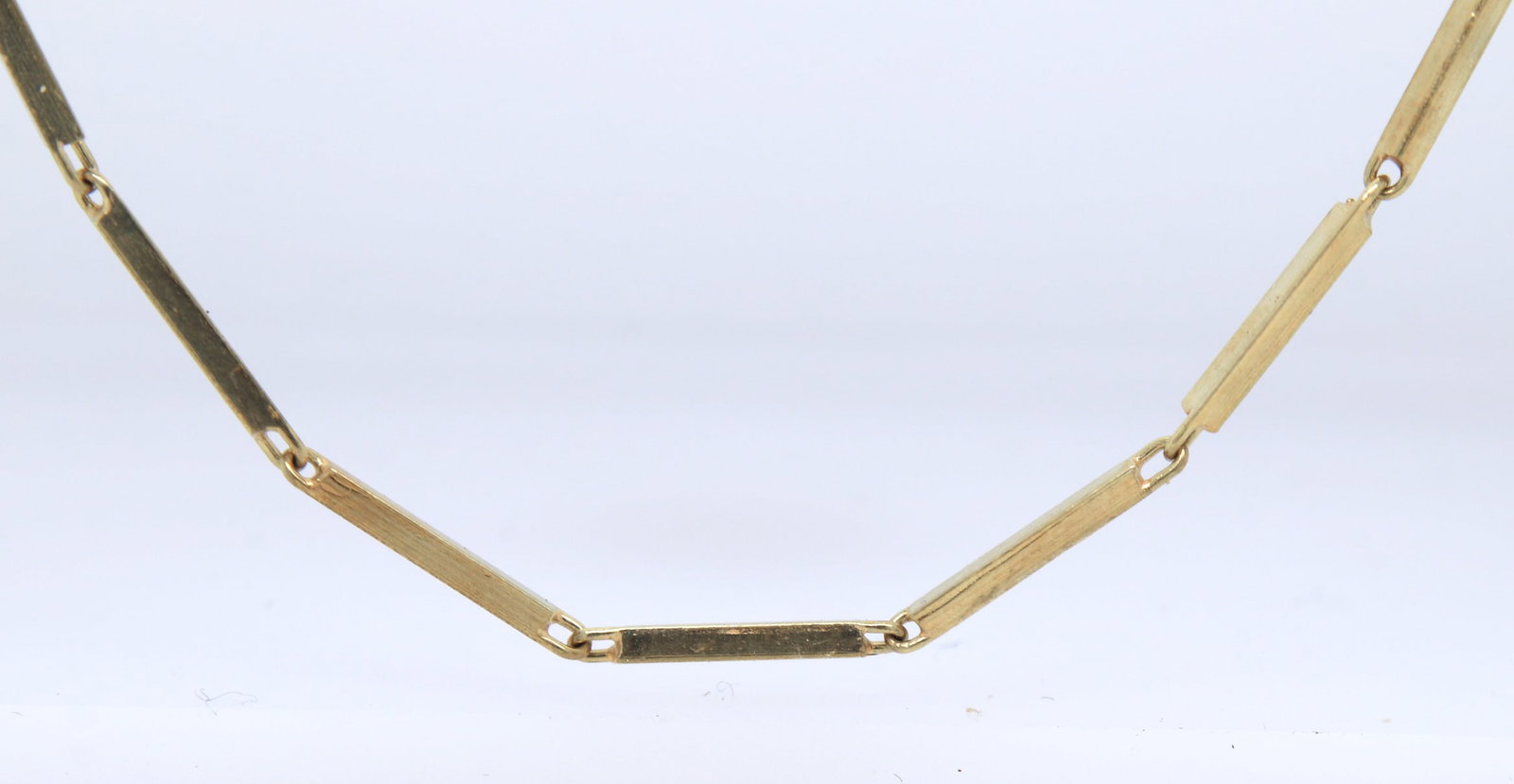 14kt Yellow gold Bar link chain necklace: 14kt Yellow gold 24 inches Bar link chain necklace with spring ring clasp. Total weight of chain 11.38 grams.