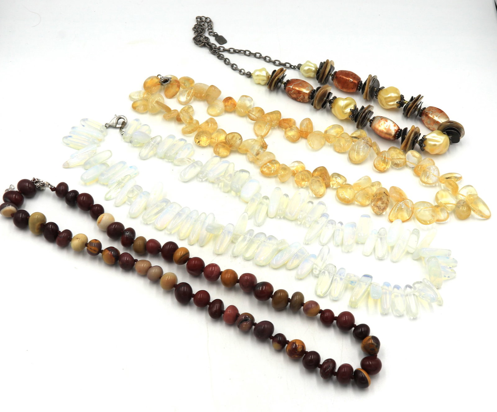 Group lot of 4 gemstone necklaces: Group lot of 4 gemstone necklaces. Total weight of lot is 283.1 grams.