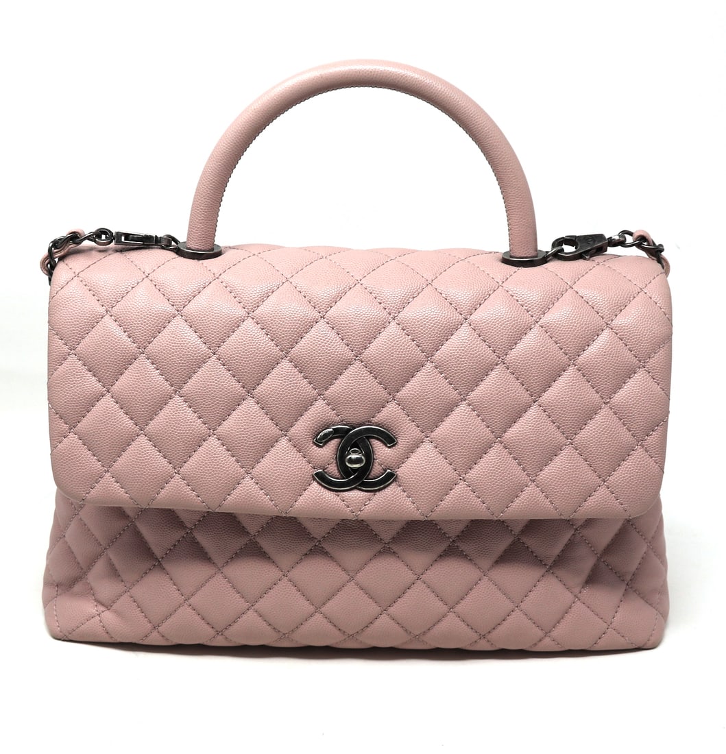 Chanel rectangular flap with top handle pink lambskin purse: Preowned authentic Chanel rectangular flap with top handle light pink lambskin purse with silver tone hardware. Comes with dust bag, box and authentic card. 13"x8". Made in Italy.