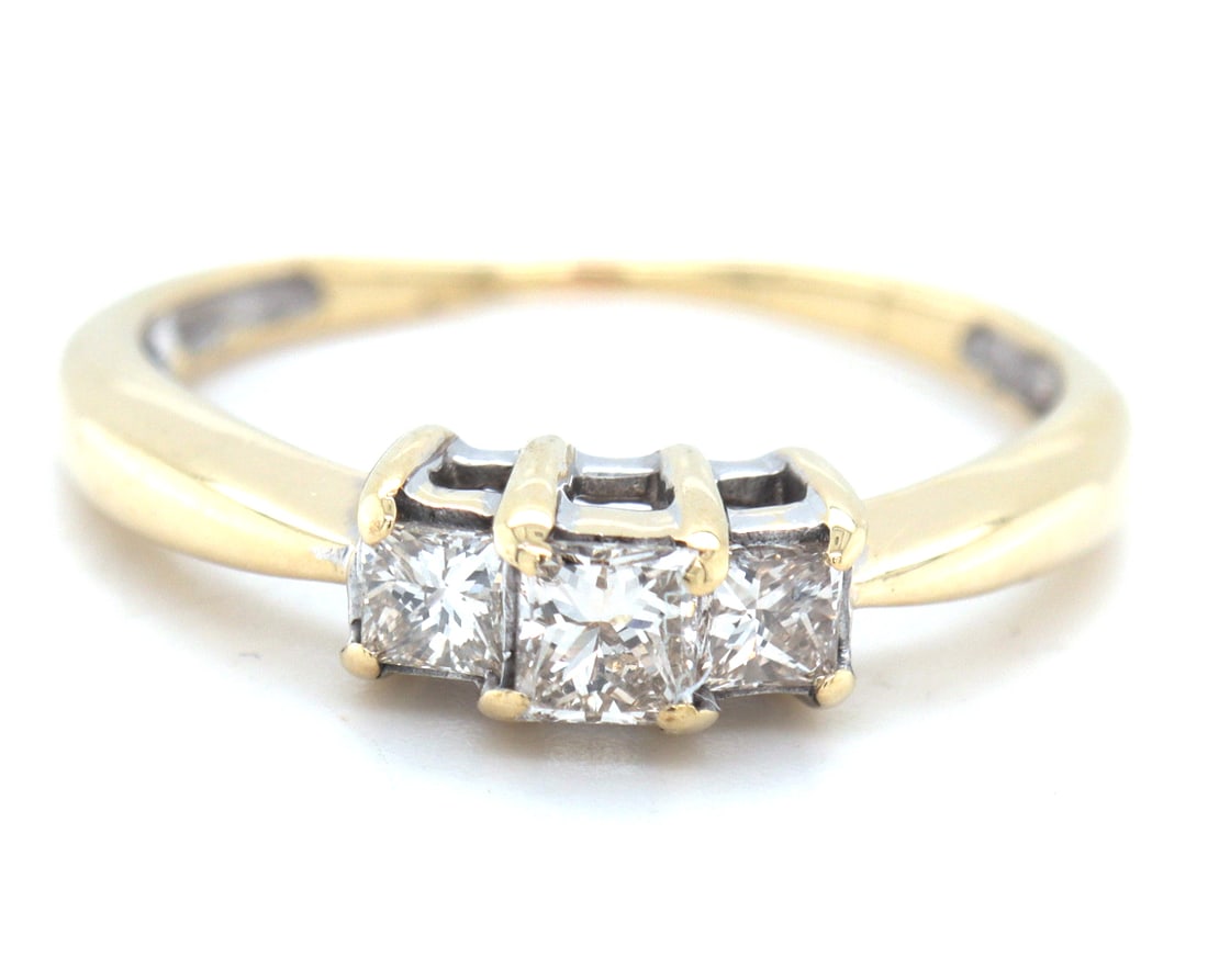 14kt Yellow gold 0.55ctw princess cut 3 stone diamond engagement ring: 14kt Yellow gold approximate 0.55ctw princess cut 3 stone diamond engagement ring. Total weight of ring is 2.60 grams. Ring size 8.25"