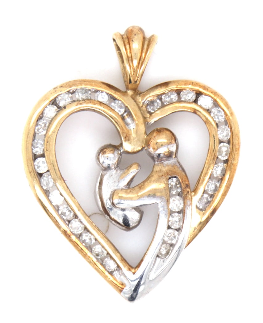10kt Yellow gold heart shaped mother and baby pendant: 10kt Yellow gold diamond heart shaped mother and baby pendant. Total weight of pendant is 1.9 grams.