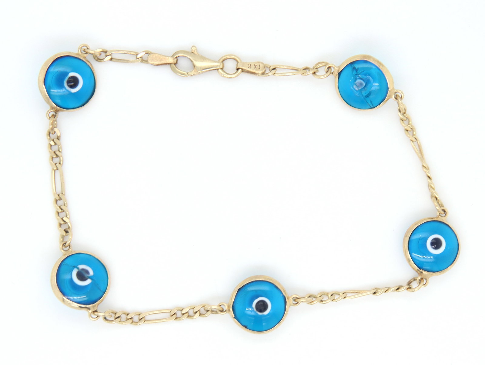14kt Yellow gold Guardian eye link evil eye round bolo bracelet: 14kt Yellow gold Guardian eye link evil eye round bolo Figaro 7 inches bracelet. Total weight of bracelet is 4.5 grams.