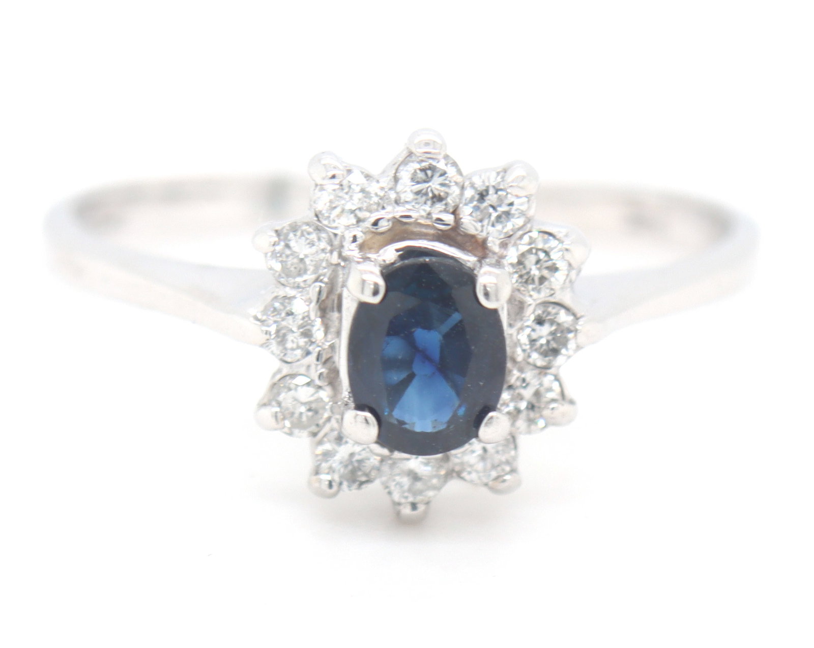 14kt White gold sapphire and diamond halo ring: 14kt White gold blue sapphire and diamond halo ring. Total weight of ring is 2.52 grams. Ring size 8.5"