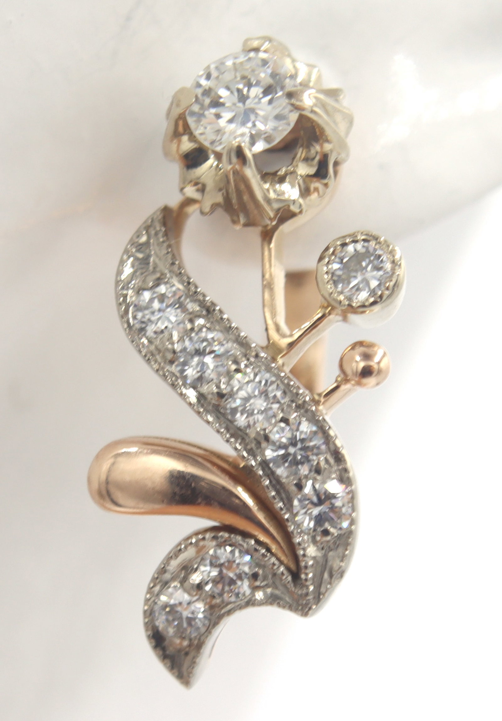 Vintage Diamond Flower Earrings in Rose Gold: Vintage Diamond Flower Earrings in 14kt Rose Gold.? Diamonds Carat Weight: Approx. 0.80ctw. Earring Dimensions: Approx. 11.0 X 18.0 MM. Weight: Approx. 5.10 Grams.