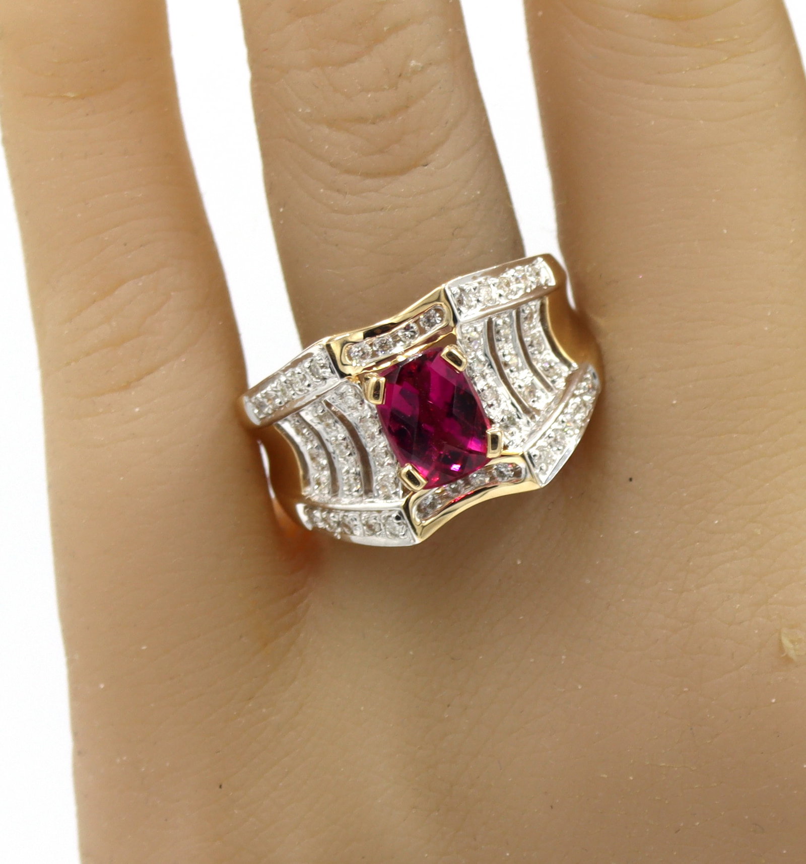 14kt Yellow gold 1.50ctw pink tourmaline and diamond wide band: 14kt Yellow Gold approximate 1.50ctw Pink Tourmaline and approximate 0.45ctw? Diamond Wide Band. Color H, Clarity SI. Total weight of Ring 8.90 Grams. Ring Size 9.25"