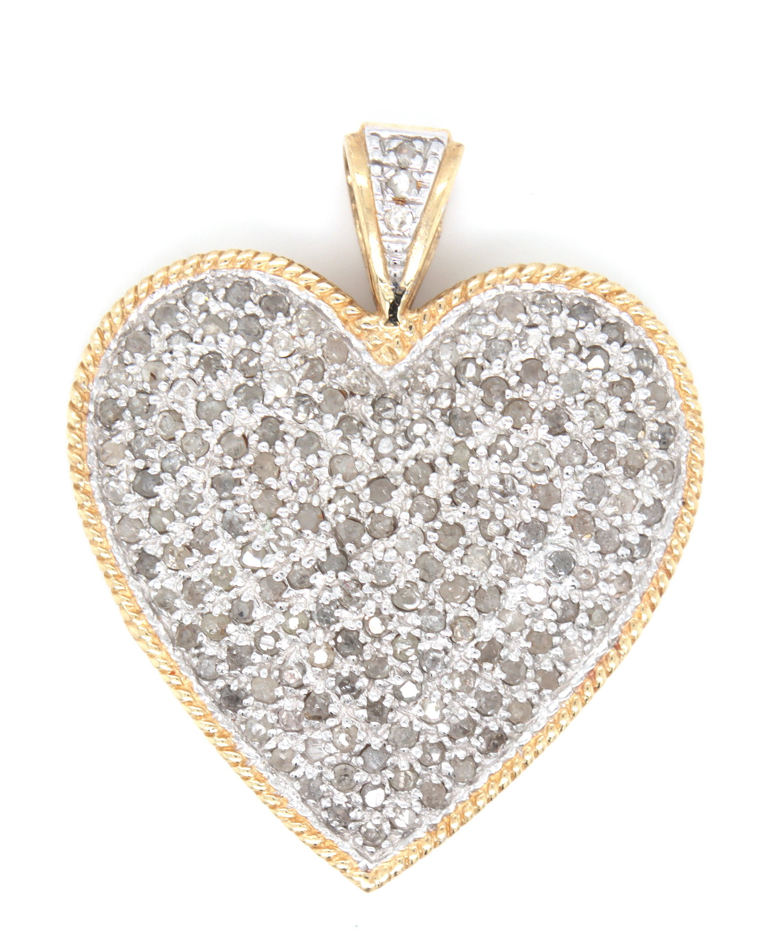 10kt Yellow gold diamond heart shaped pendant: 10kt Yellow gold diamond heart shaped pendant. Total weight of the pendant is 5.4 grams.