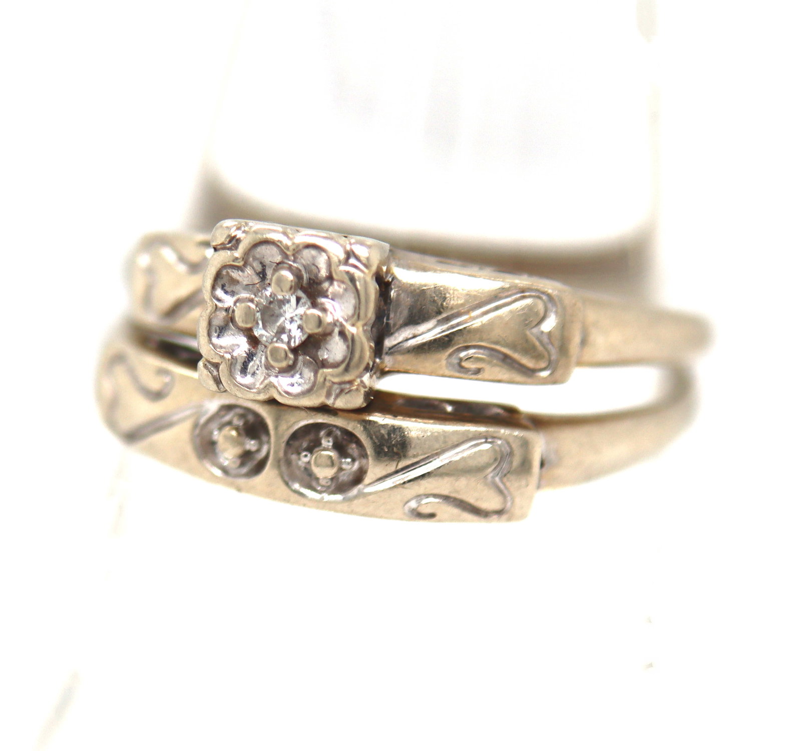 14kt White gold princess cut diamond bridal set: 14kt White gold princess cut diamond bridal set. The total weight of the set is 3.6 grams. Ring size 7.5".