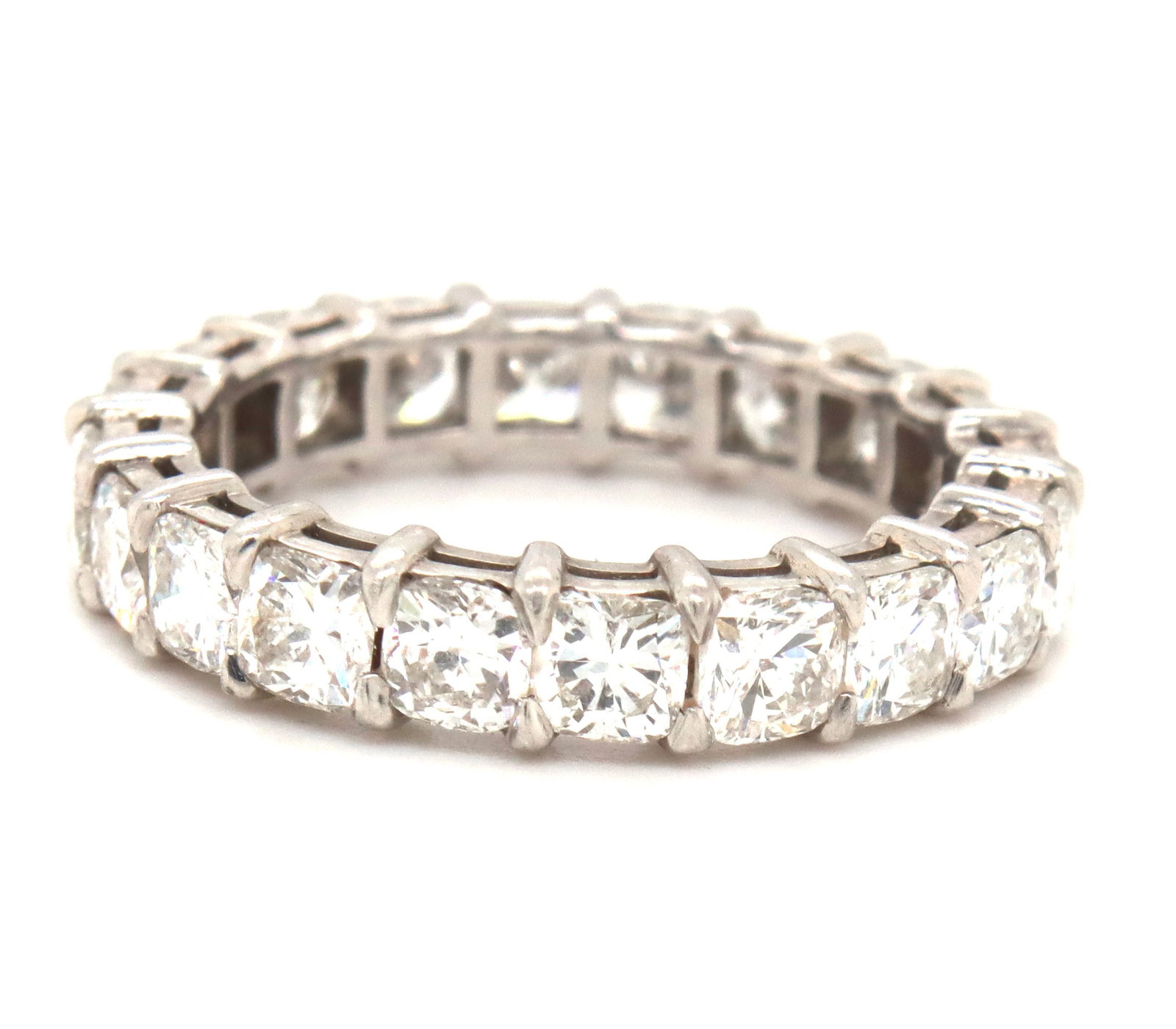 Platinum 4.05ctw cushion cut diamond band: Platinum approximate 4.05ctw cushion cut diamond band. Color F-G, Clarity VS. The total weight of the band is 5.10 grams. Ring size 7.5".