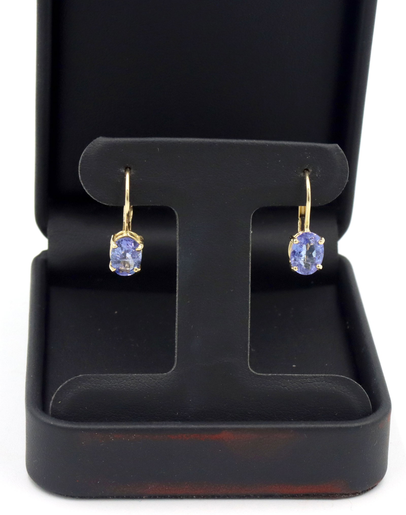 14kt Yellow gold oval Tanzanite earrings: 14kt Yellow gold approximate 1.70ctw oval Tanzanite earrings. The total weight of the earrings is 2.20 grams.