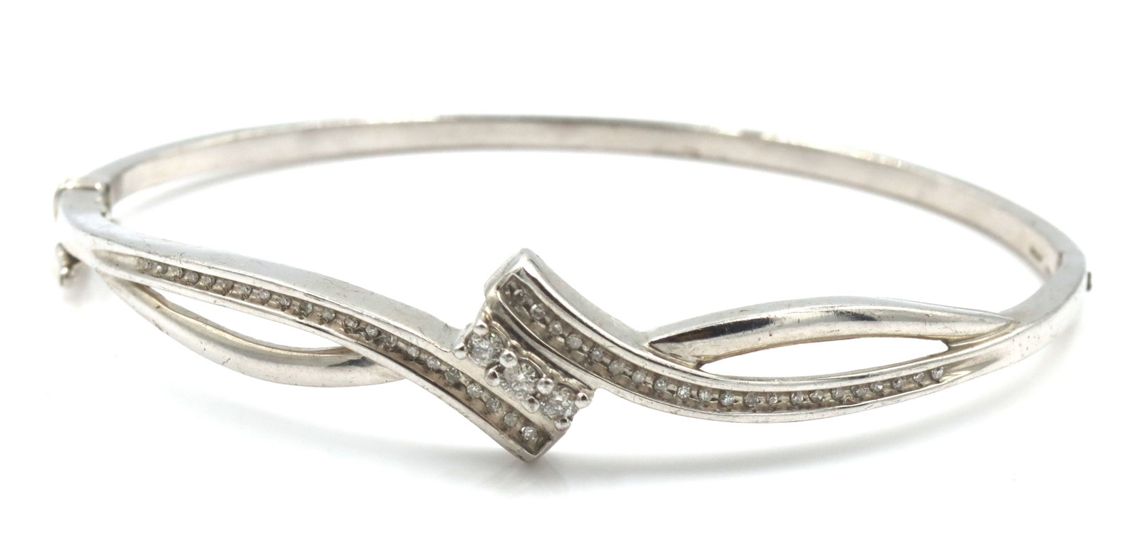 925 Sterling silver diamond bypass bangle bracelet: 925 Sterling silver diamond bypass bangle bracelet. The total weight of the bangle is 12 grams.
