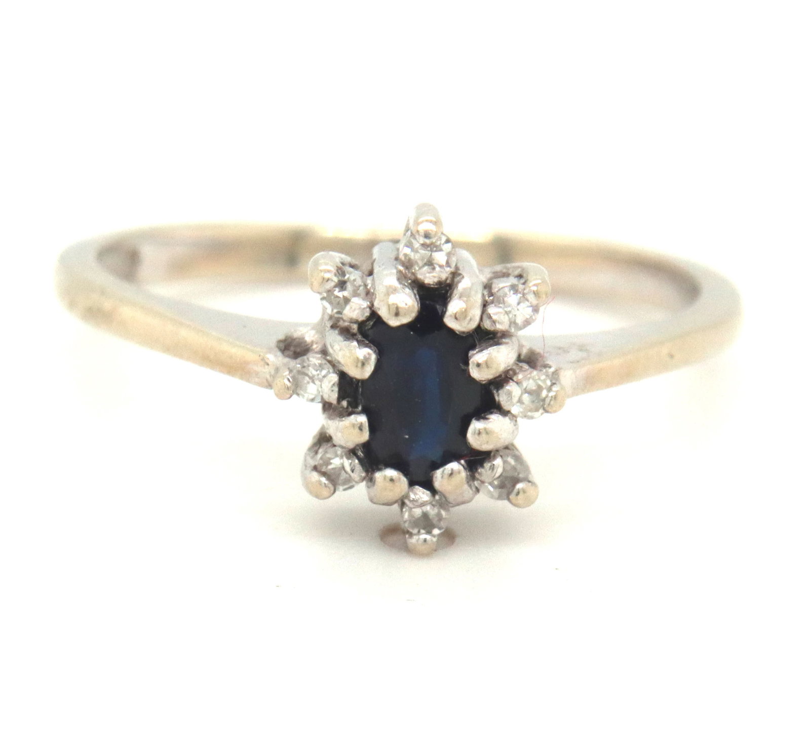 10kt White gold blue sapphire and diamond ring: 10kt White gold blue sapphire and diamond ring. The total weight of the ring is 2.1 grams. Ring size 5.5".