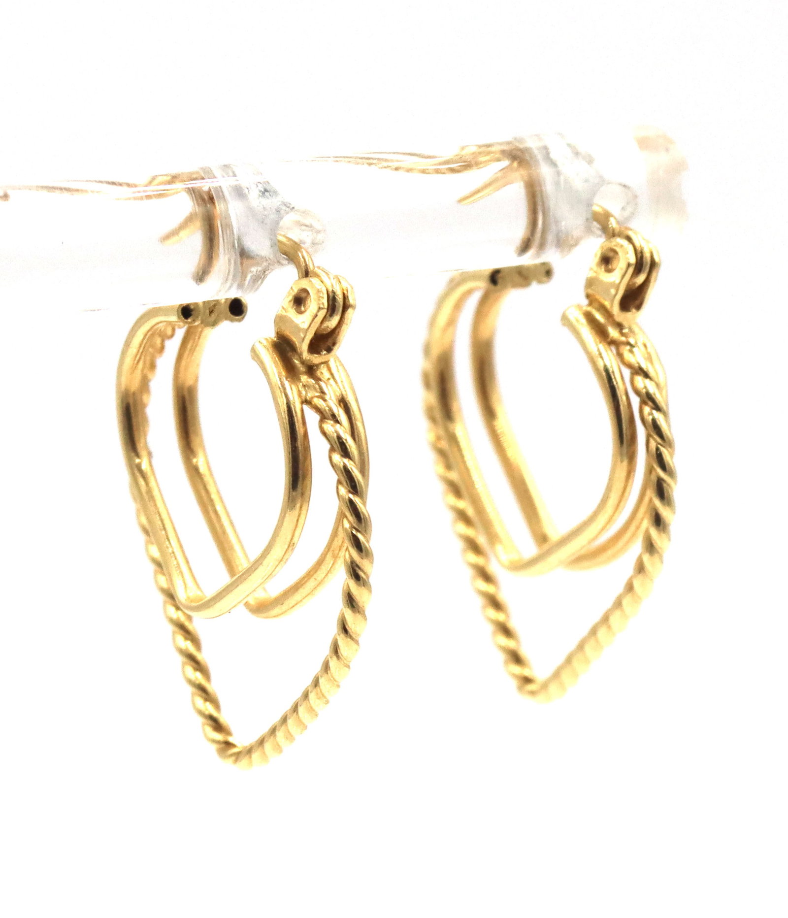 14kt Yellow gold double heart shaped earrings: 14kt Yellow gold double heart shaped earrings. The total weight of the earrings is 1.4 grams.