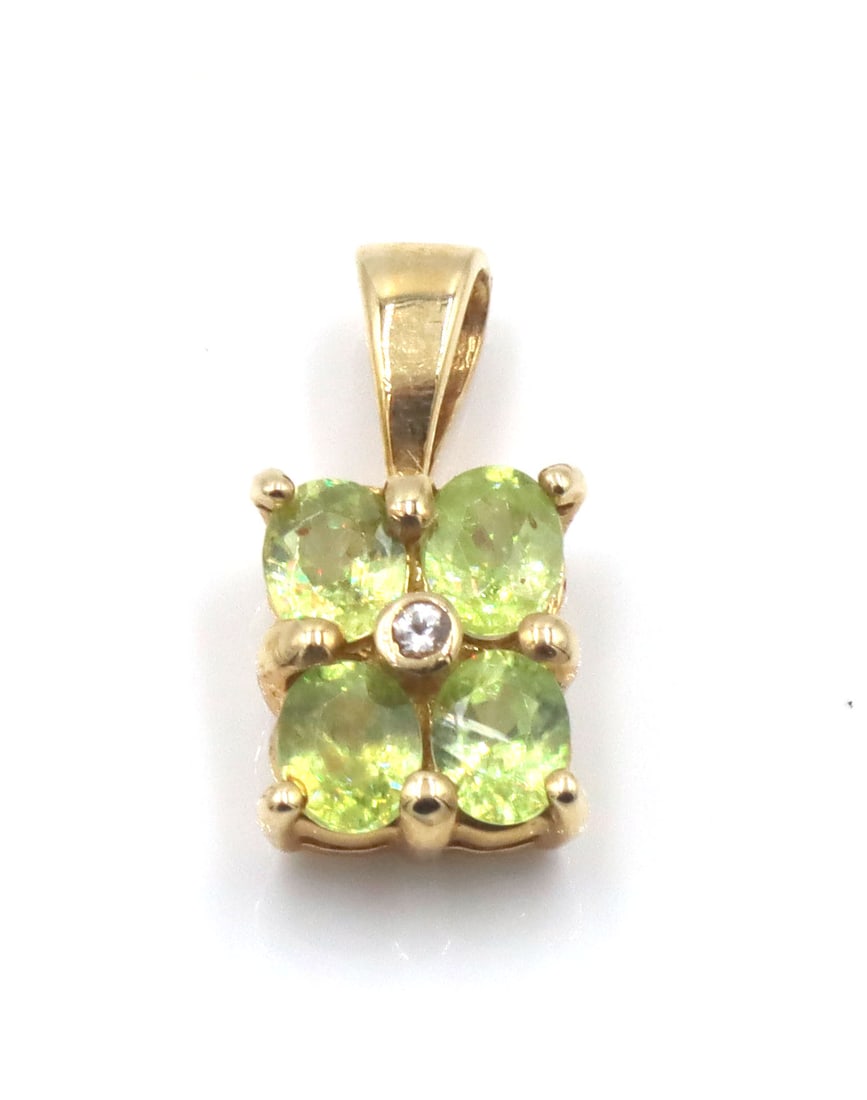 14kt Yellow gold peridot pendant: 14kt Yellow gold peridot pendant. The total weight of the pendant is 1.3 grams.