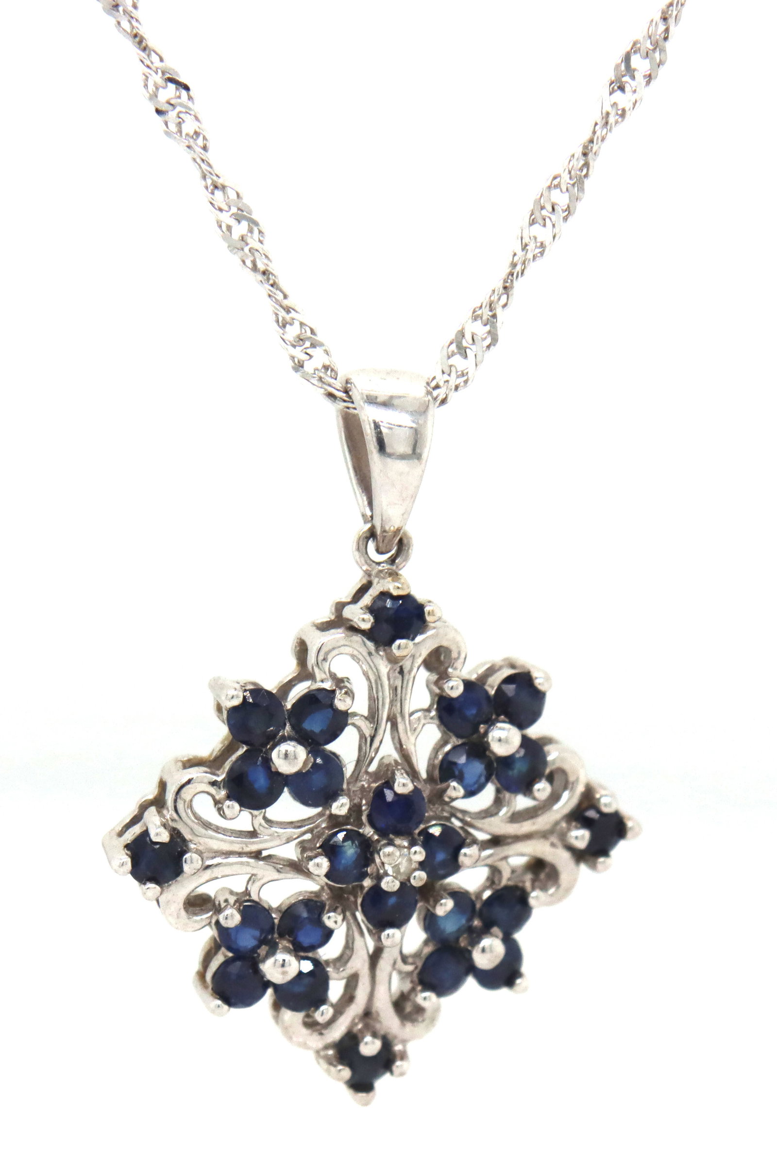 10kt White gold blue sapphire pendant on rope chain necklace: 10kt White gold blue sapphire pendant on 18-inch rope chain necklace with spring ring clasp. The total weight of the necklace is 3.4 grams.
