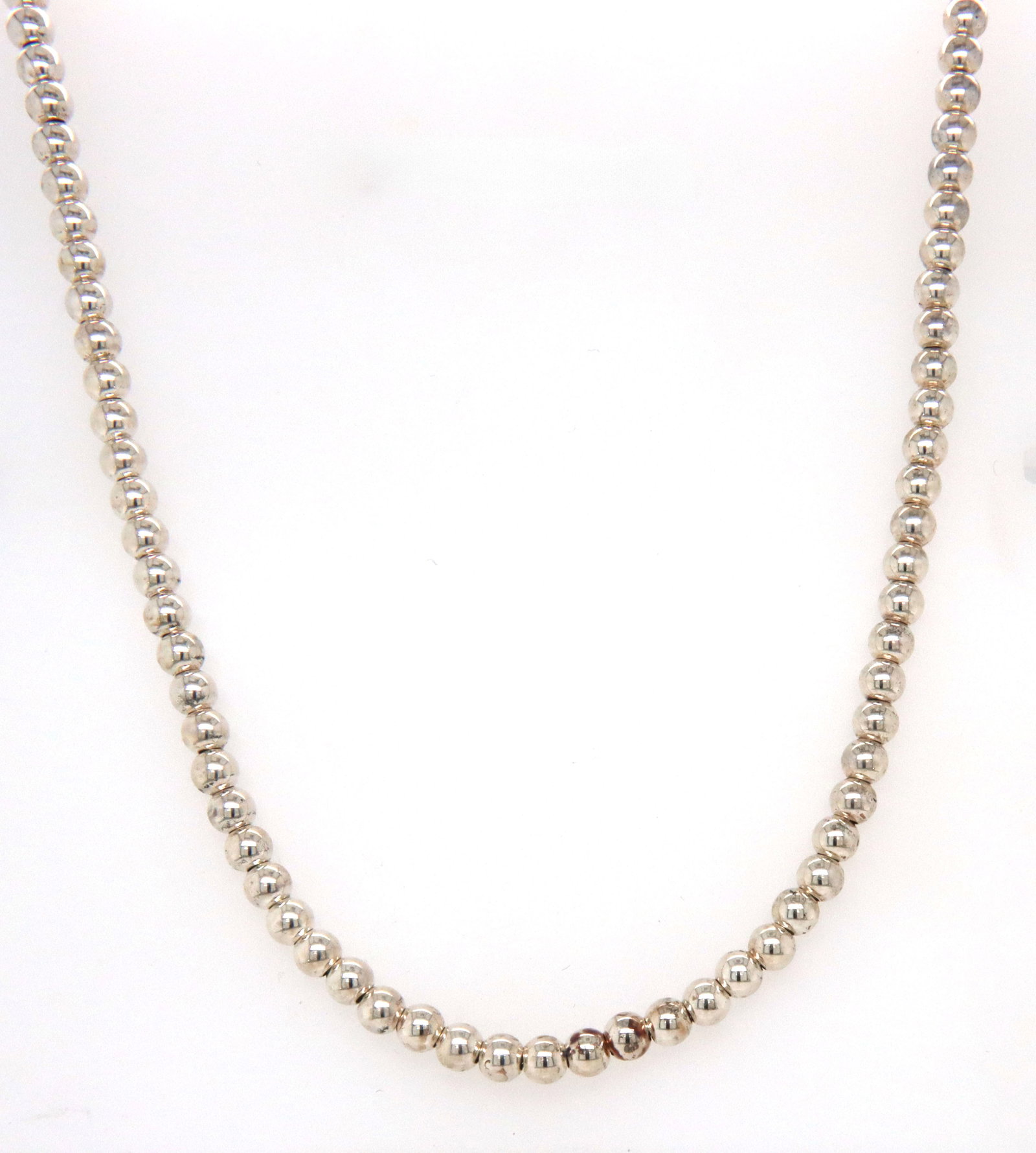 Tiffany & Co bead toggle necklace: Tiffany & Co bead toggle 16-inch necklace in 925 sterling silver. The total weight of the necklace is 13.10 grams.