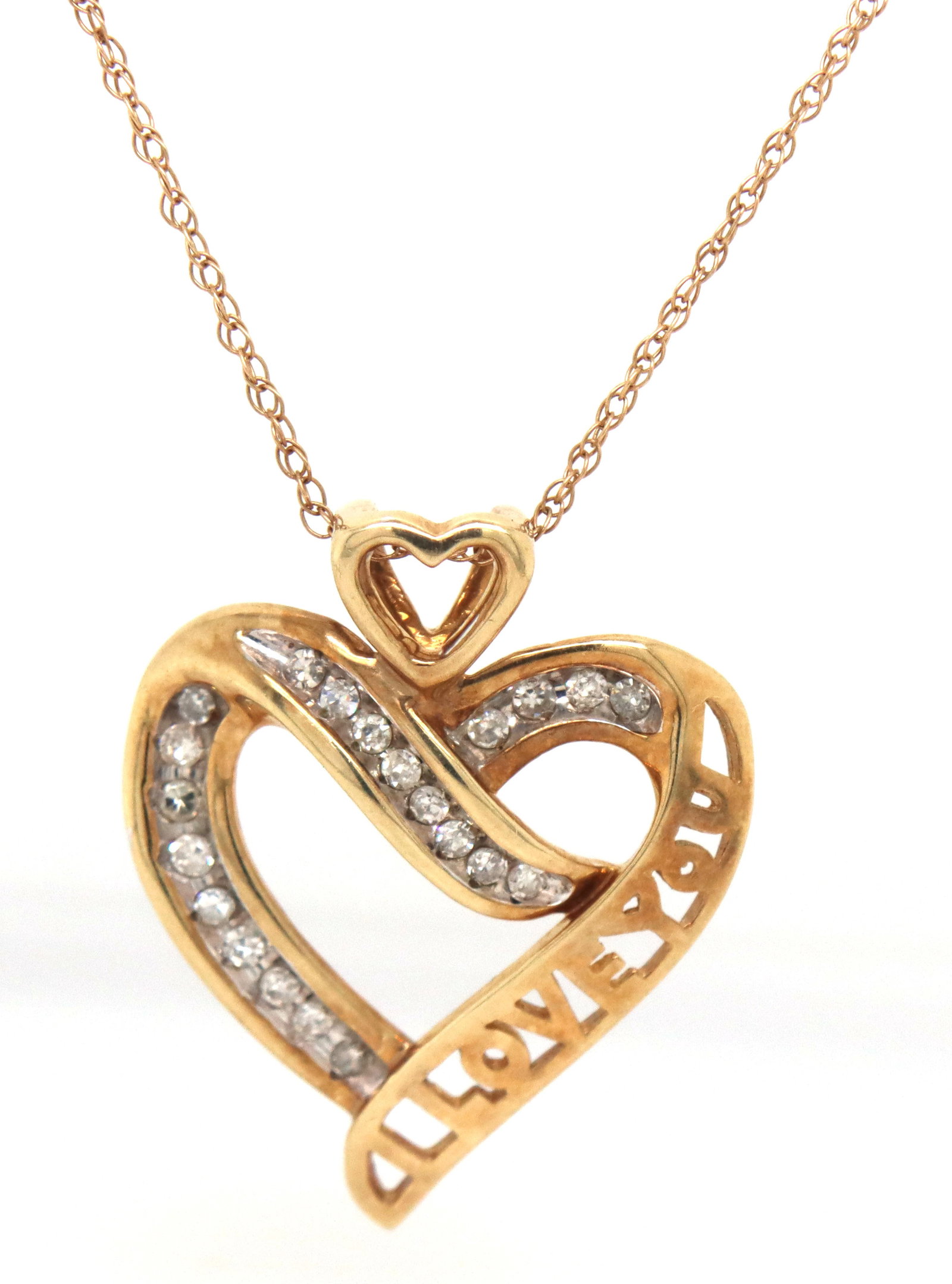 10kt Yellow gold heart shaped diamond pendant on chain (1 of 3)