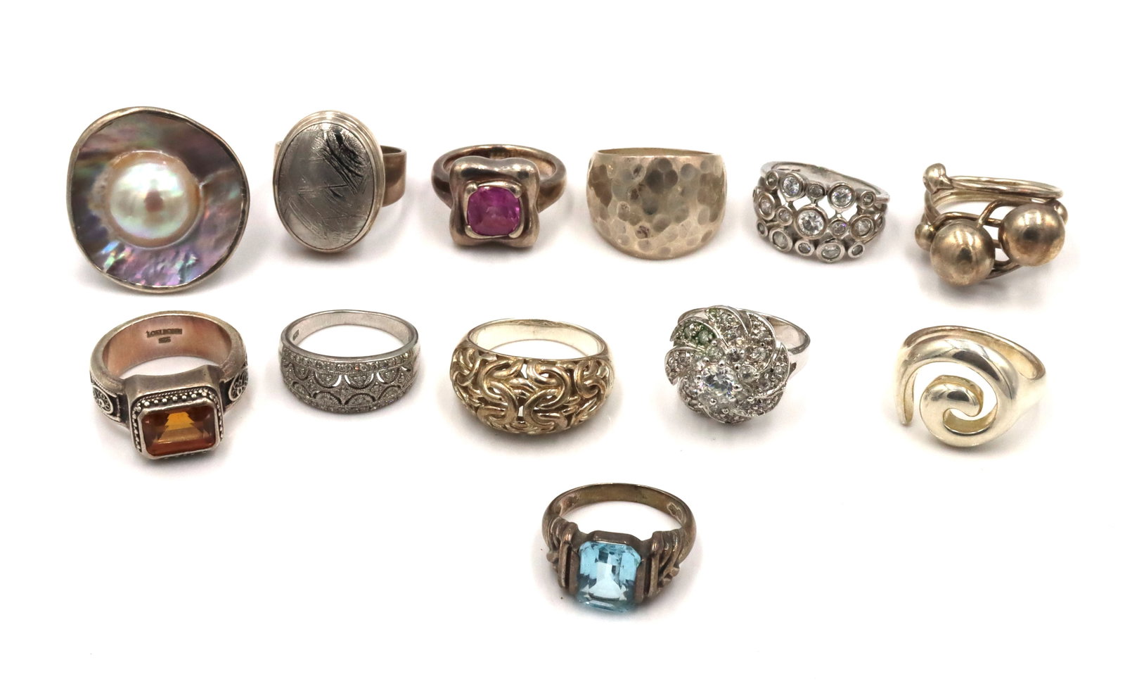 Group lot of Vintage 925 sterling silver 12 rings: Group lot of Vintage 925 sterling silver 12 rings. The total weight of the lot is 89.4 grams. Ring size 7. 7.5.9.8.5.8.10"